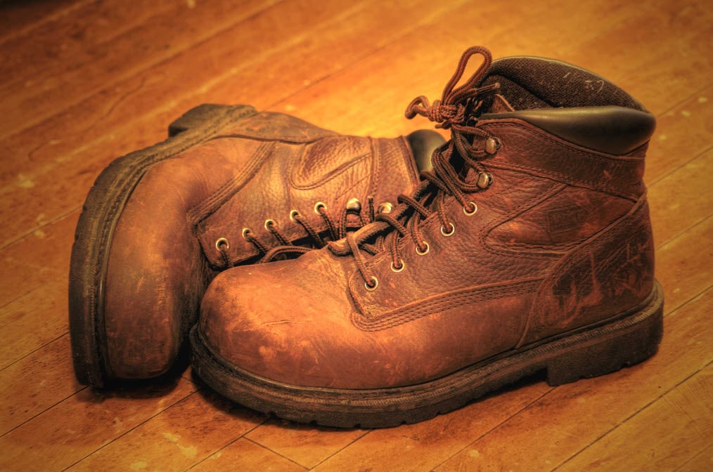 leather work boots on the floor with ankle support and steel toe