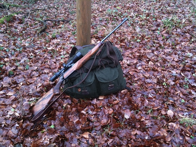 A rifle on a hunting backpack, an essential tool for packing and organizing your hunting gear