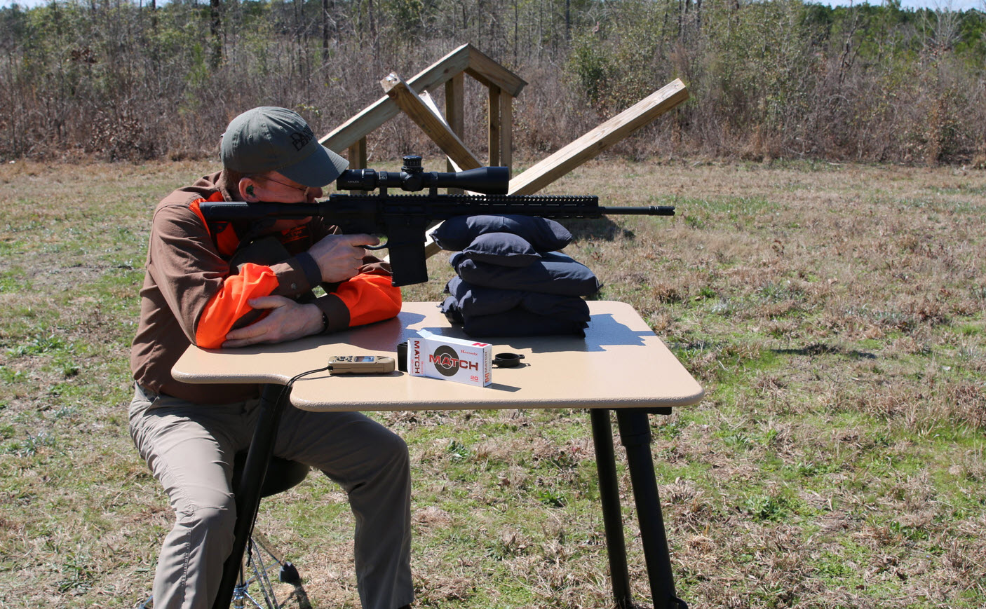 how to choose a shooting table - guy shooting ar15 from table